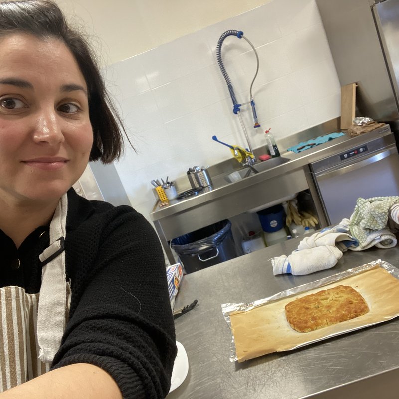 Xiana baking a Galician empanada in the kitchen